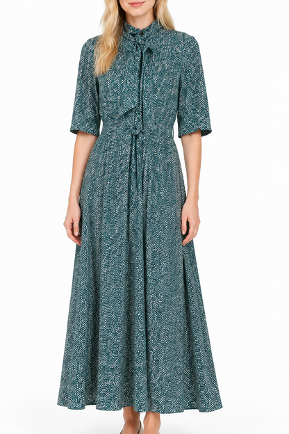 Abito vintage sartoriale in seta con fantasia verde, nero e bianco e fiocco al collo